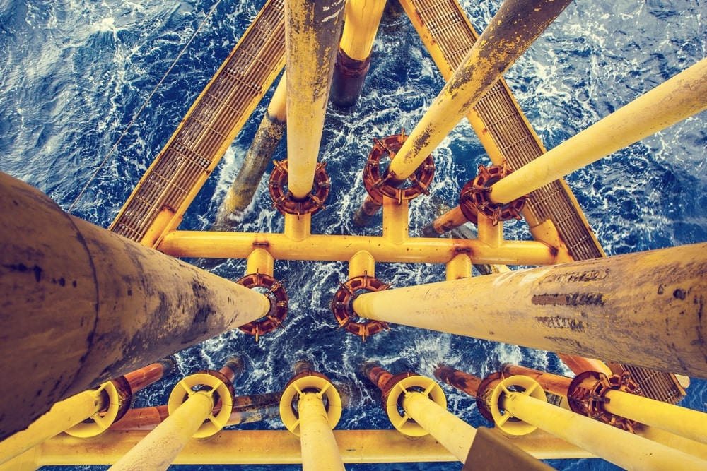Overview shot of the pipes of an oil rig.